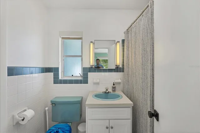 a bedroom with a large bed and a couch