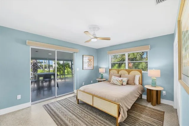 a bathroom with a granite countertop sink mirror vanity and toilet