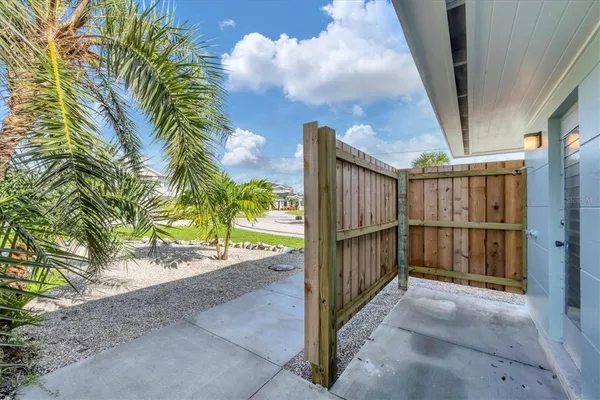 a view of a house with a yard and a garden