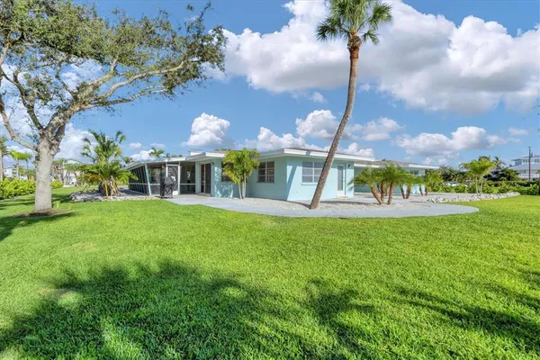 a front view of house with yard and green space