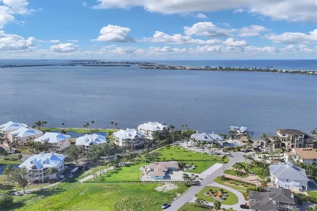 an aerial view of a house with a yard basket ball court and outdoor seating