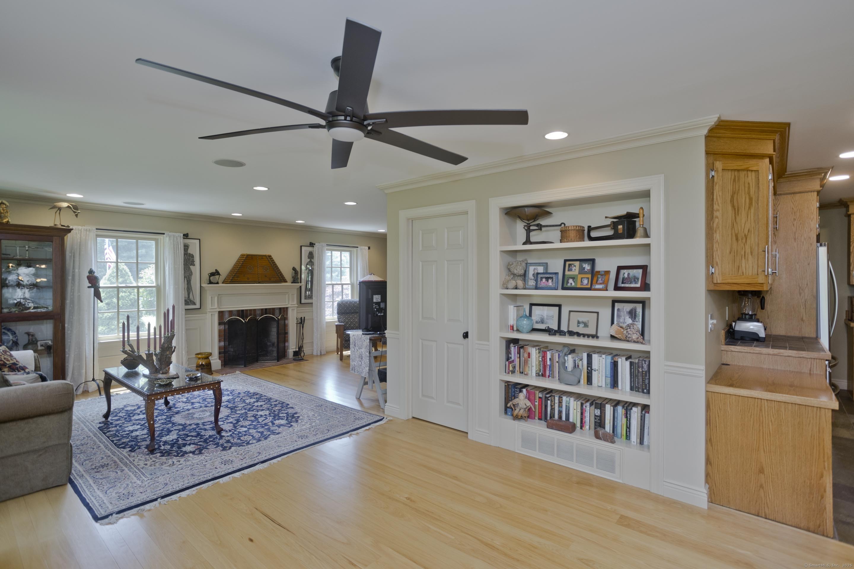 180 Leonard Road Stafford, CT 06076 - Photo 11 of 39 a living room with furniture and a book shelf