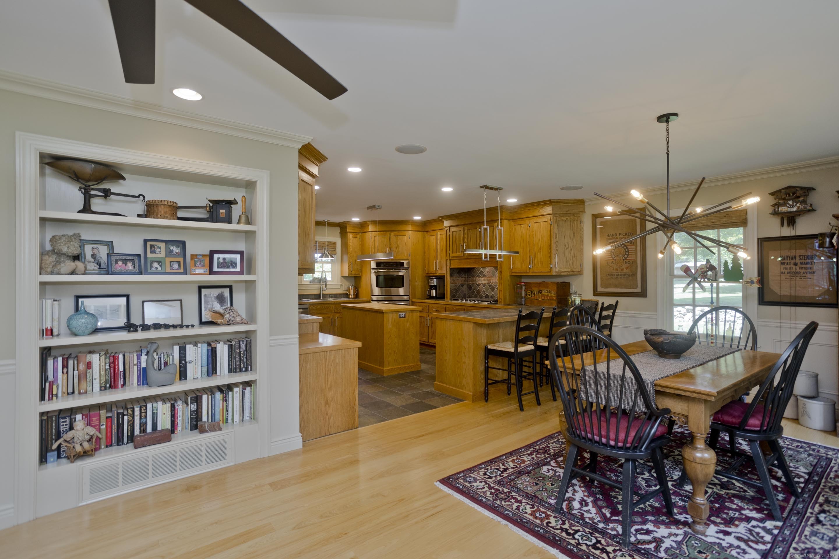 180 Leonard Road Stafford, CT 06076 - Photo 13 of 39 a dining room with lots of furniture and a book shelf