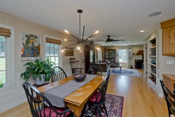 a kitchen with refrigerator and cabinets