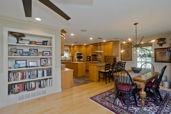 a kitchen with stainless steel appliances granite countertop a sink and cabinets