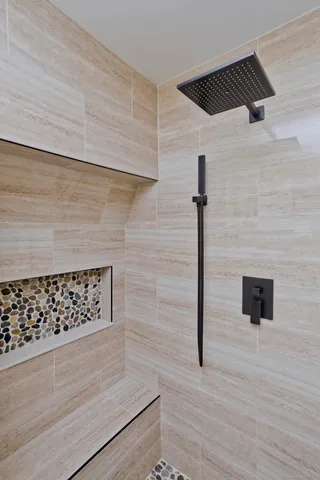 a bathroom with 2 sink and a mirror