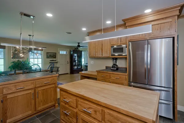 a kitchen with stainless steel appliances granite countertop a sink and cabinets