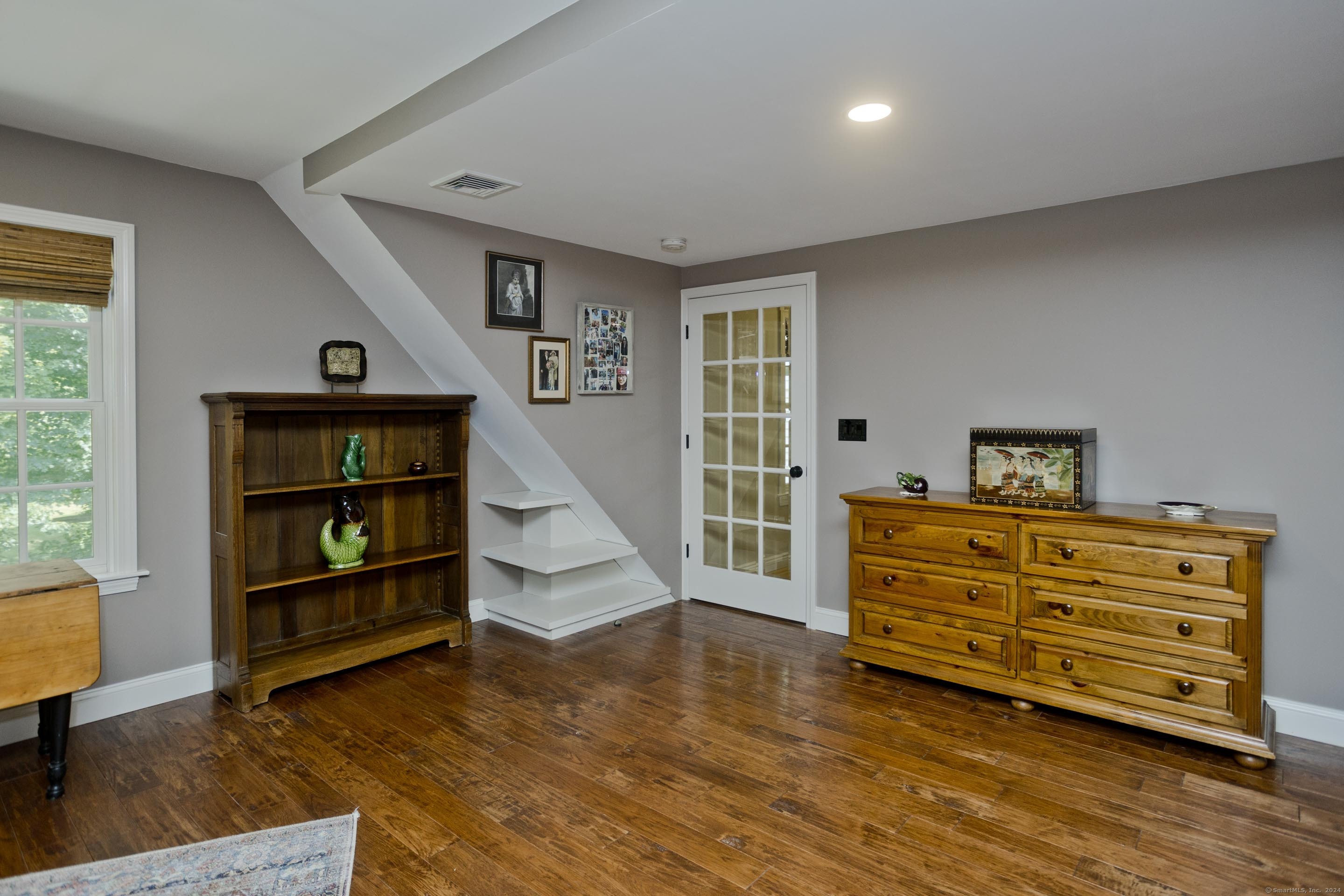 180 Leonard Road Stafford, CT 06076 - Photo 29 of 39 a view of an empty room with window and wooden floor