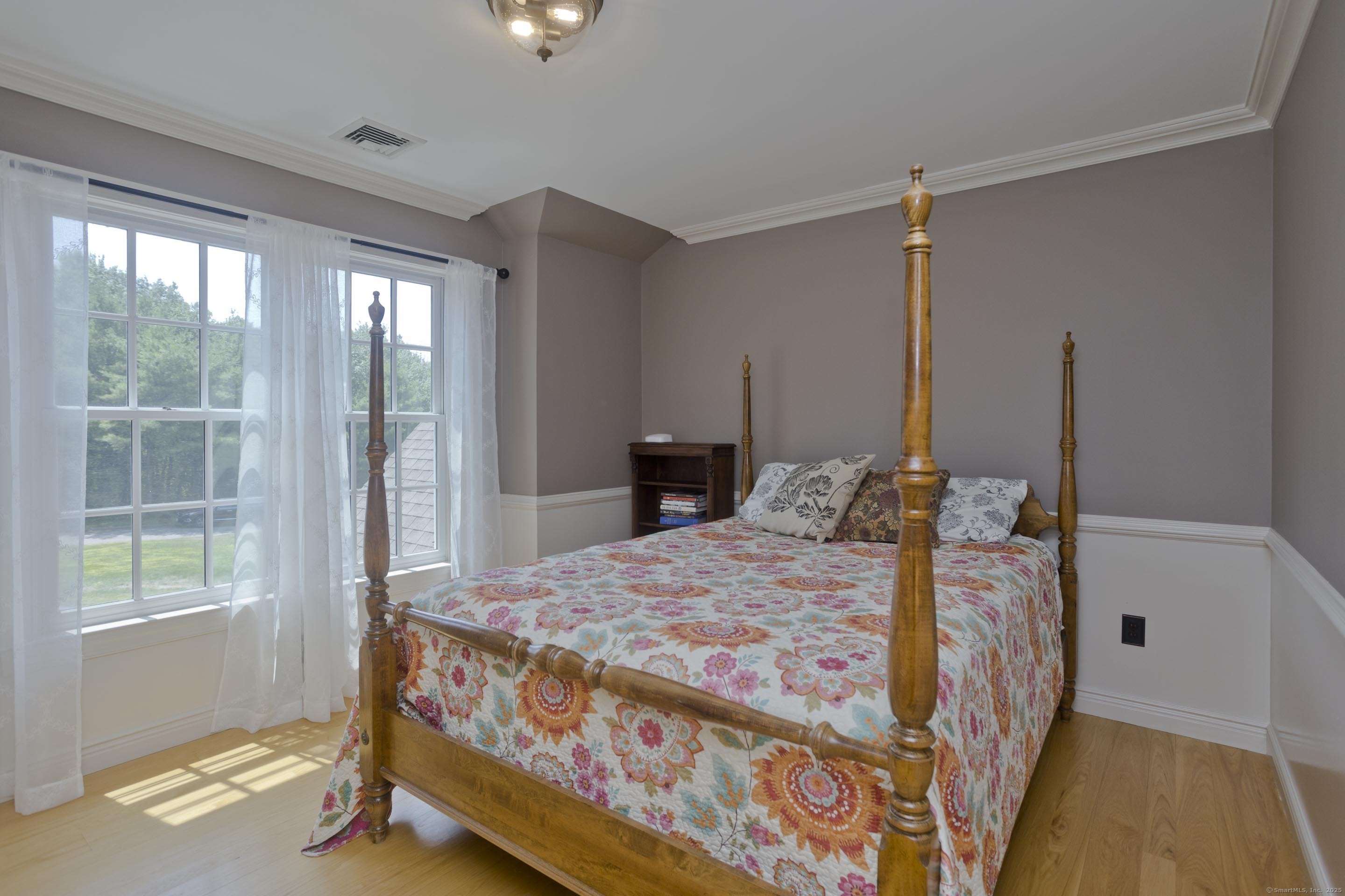 180 Leonard Road Stafford, CT 06076 - Photo 31 of 39 a bed sitting in a bedroom next to a window