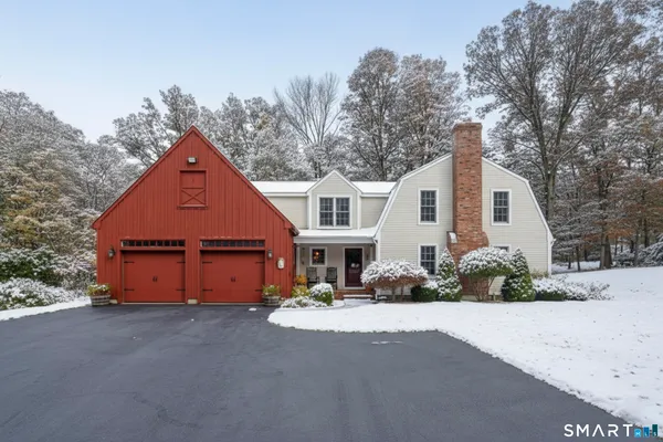 a picture of a bathroom with mirror and tiles