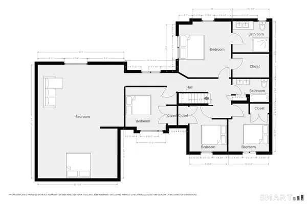 a front view of a house with a yard covered in snow