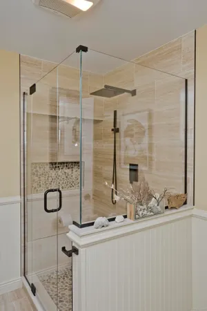 a bathroom with a shower and a sink