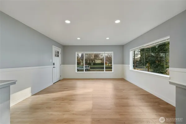 a view of an empty room with a window