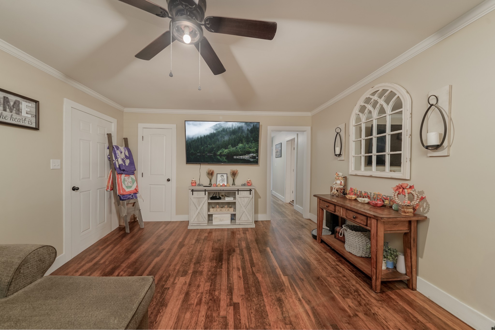 258 East Prospect Road Fayetteville, TN 37334 - Photo 11 of 26 a living room with furniture a flat screen tv and kitchen view