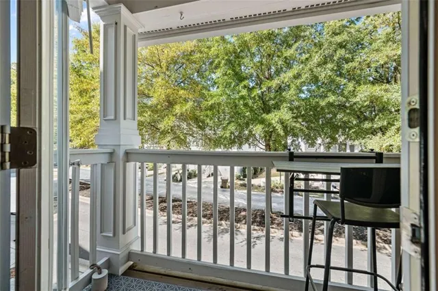 a kitchen with stainless steel appliances granite countertop a refrigerator a stove and a sink with wooden floor