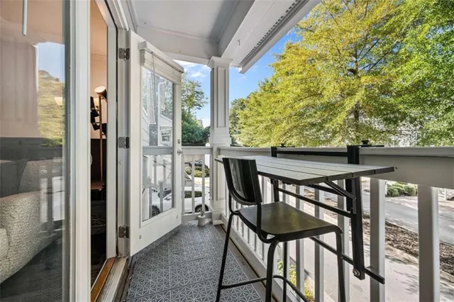 a kitchen with granite countertop a stove and a wooden floors