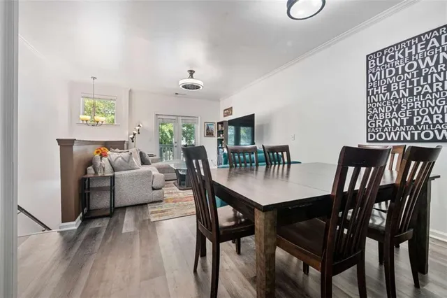 a view of hallway with wooden floor and stairs