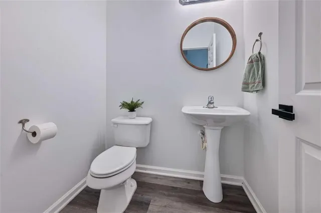 a backyard of a house with fire pit and outdoor seating