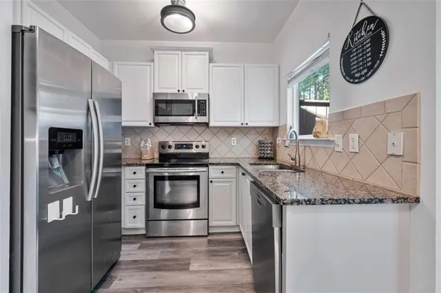 a bedroom with a bed and a flat tv screen