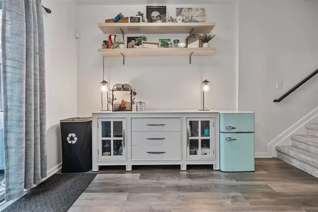 a view of a livingroom with workspace and a window