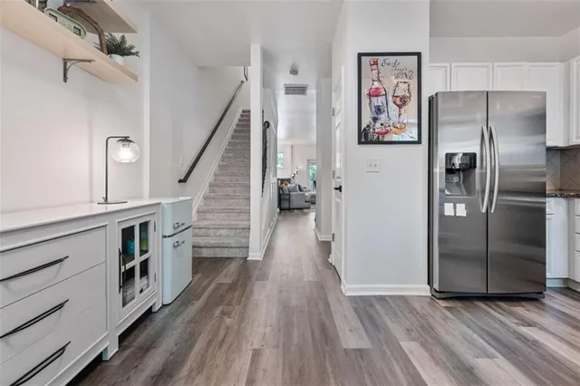 a view of a livingroom with workspace and a window