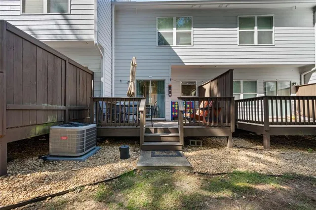 a bathroom with a sink a toilet and shower curtain