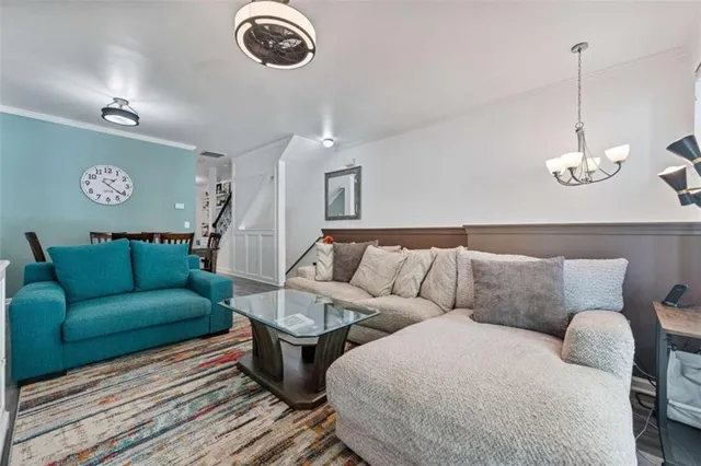 a kitchen with stainless steel appliances granite countertop a stove a refrigerator and a sink