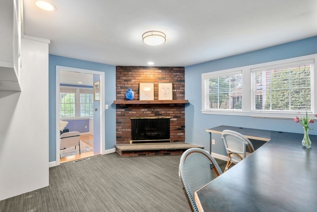 26 William Street Needham, MA 02494 - Photo 18 of 35 a living room with furniture and a fireplace