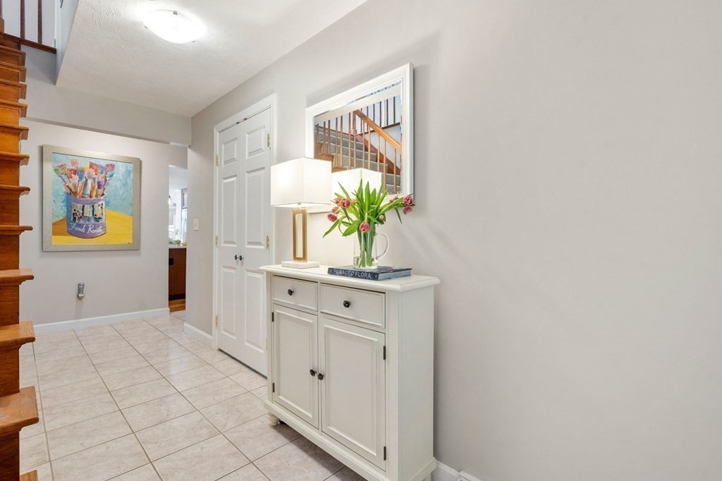 26 William Street Needham, MA 02494 - Photo 2 of 35 a spacious bathroom with a sink a mirror and a picture on the wall