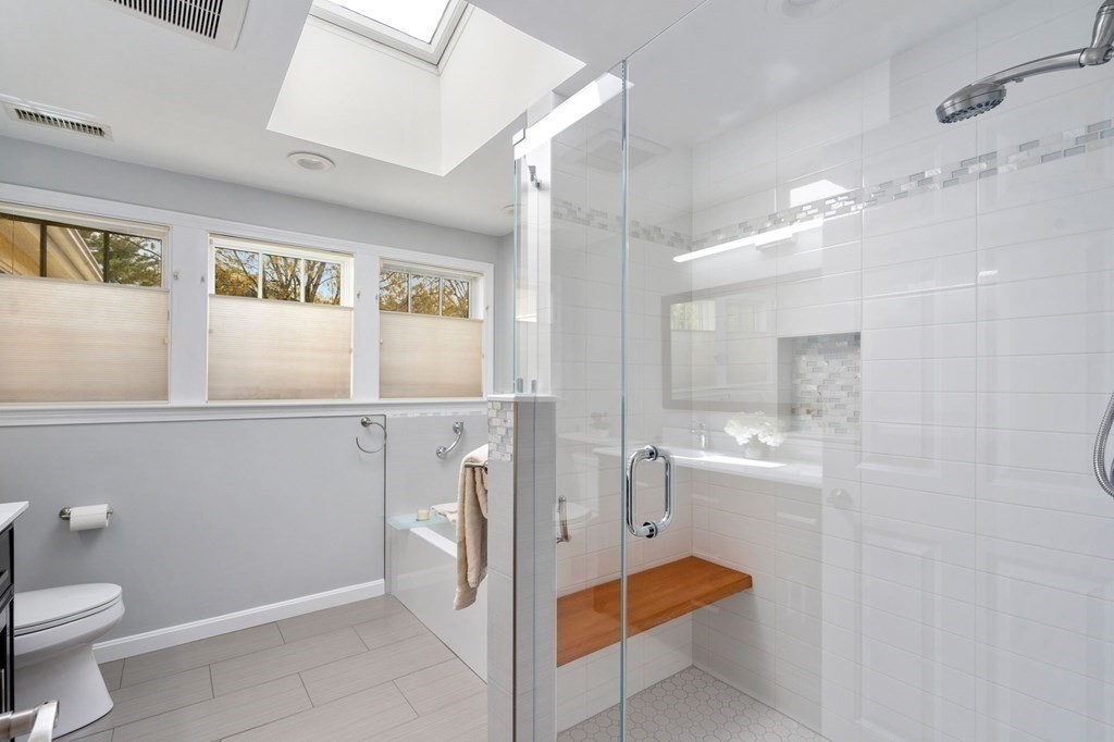 26 William Street Needham, MA 02494 - Photo 25 of 35 a bathroom with a sink a toilet and shower
