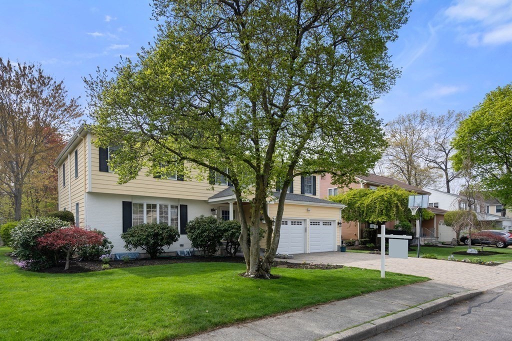 26 William Street Needham, MA 02494 - Photo 35 of 35 a front view of a house with a garden and trees