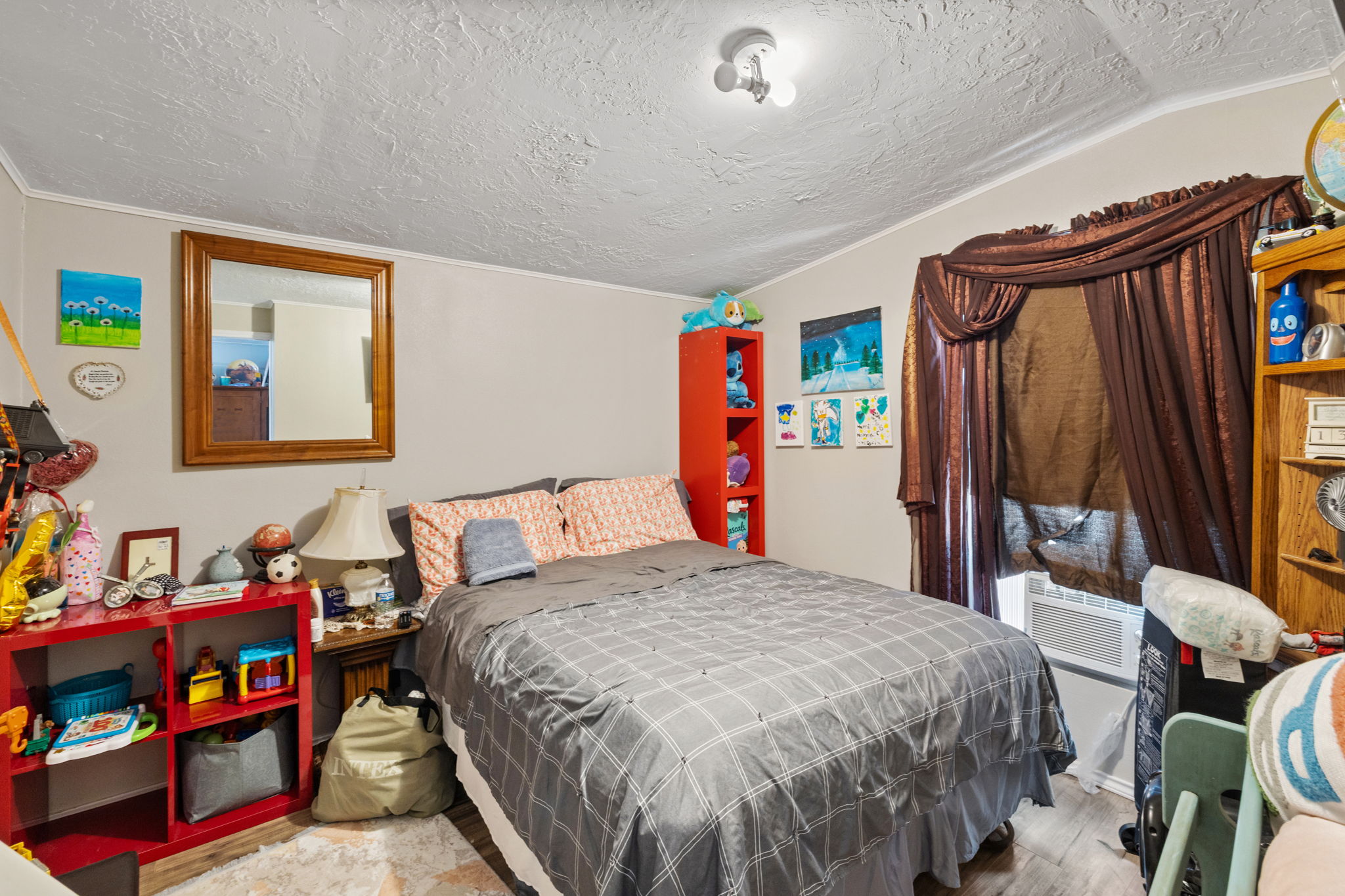 215 Sayers Road Bastrop, TX 78602 - Photo 16 of 26 A comforting retreat, this bedroom offers ample space and a window with natural illumination.