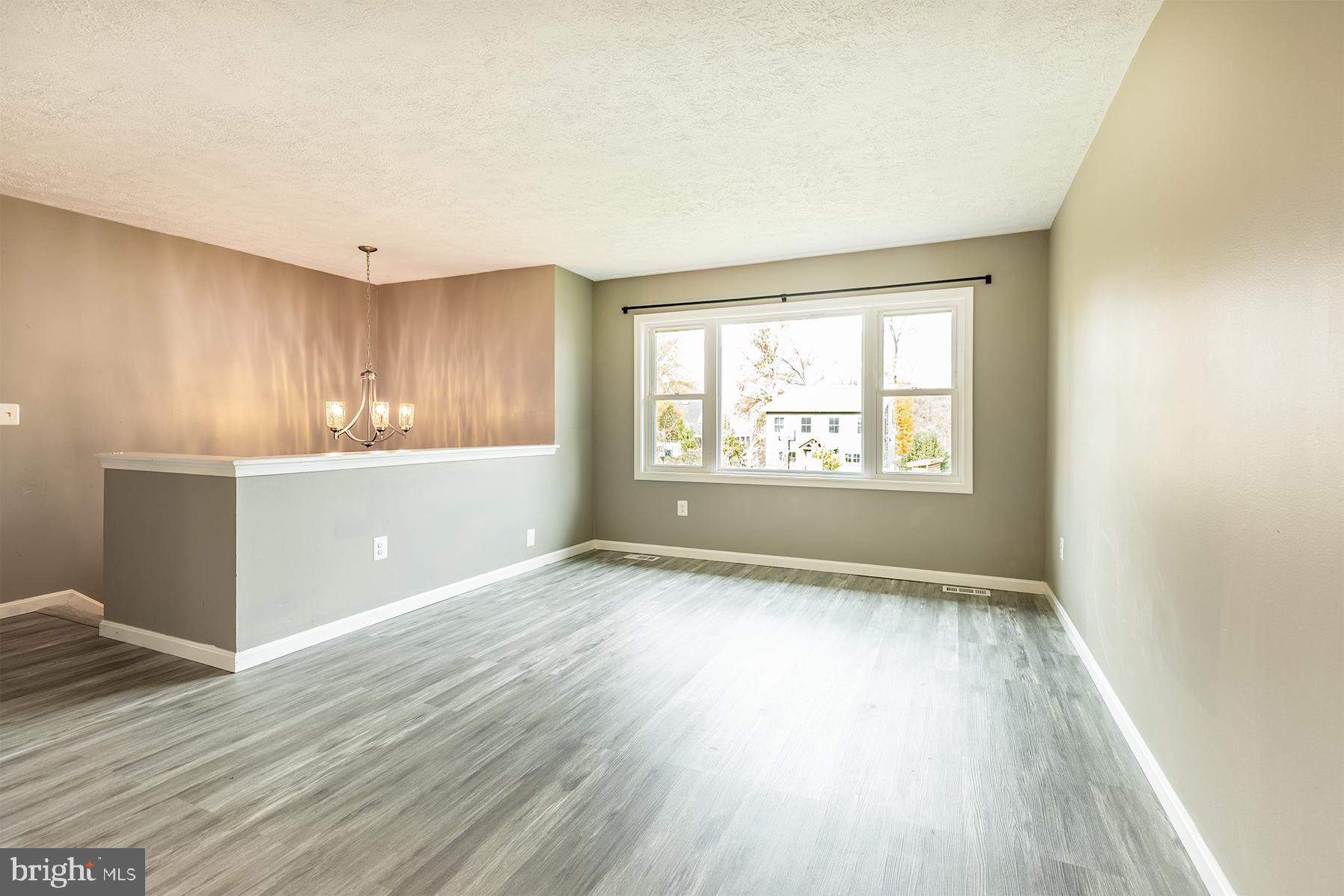 847 Harbor View Terrace Annapolis, MD 21409 - Photo 18 of 42 a view of an empty room with wooden floor and a window