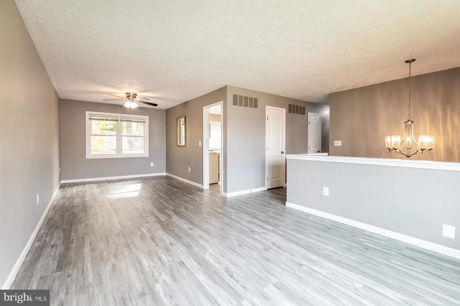 847 Harbor View Terrace Annapolis, MD 21409 - Photo 20 of 42 a view of an empty room with window and wooden floor