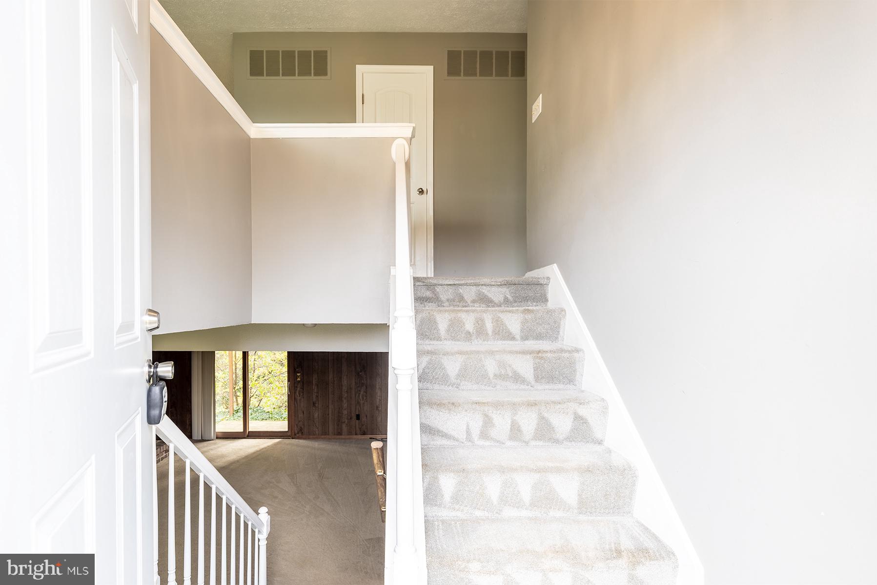 847 Harbor View Terrace Annapolis, MD 21409 - Photo 34 of 42 a view of staircase with white walls and a window