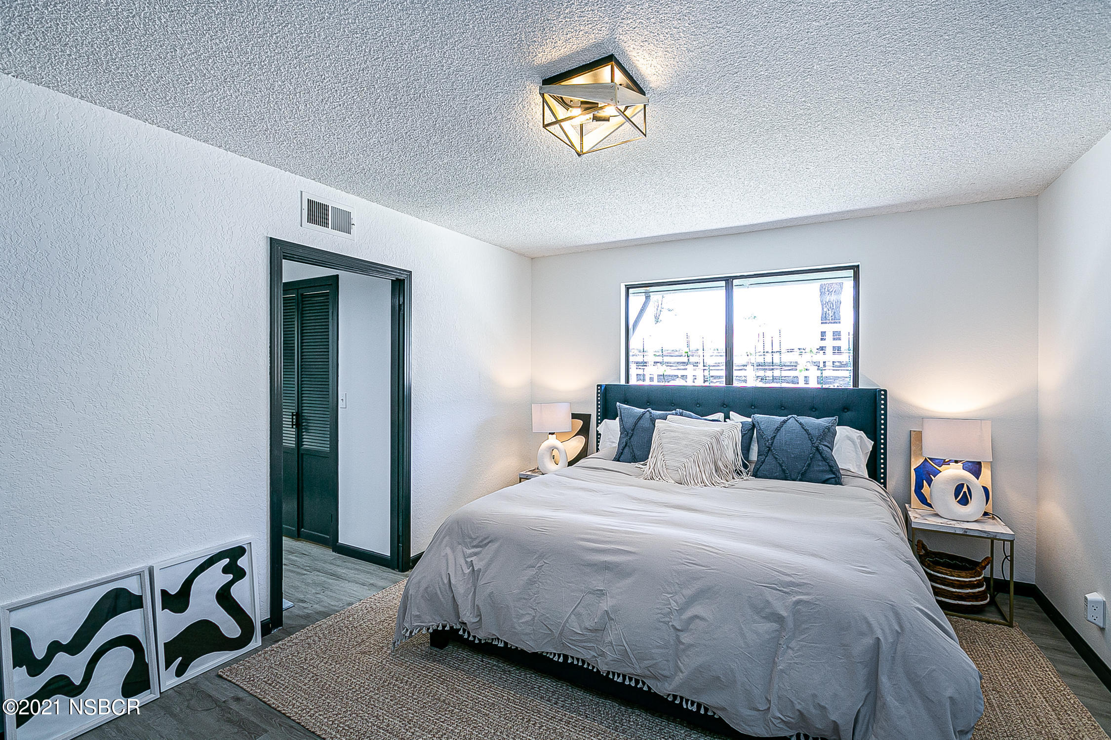 5375 Campbell Road Lompoc, CA 93436 - Photo 15 of 48 a bedroom with a bed and a table