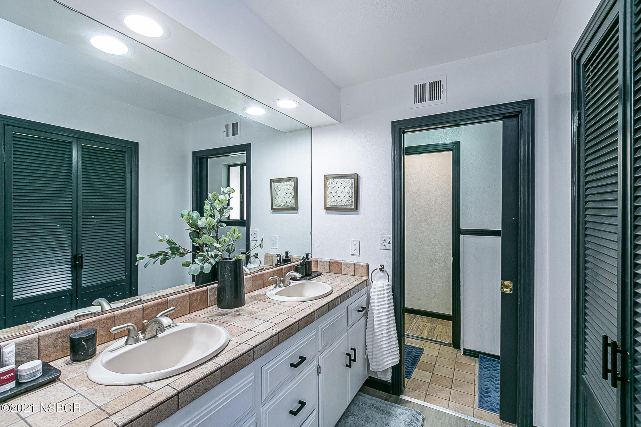 5375 Campbell Road Lompoc, CA 93436 - Photo 17 of 48 a bathroom with a granite countertop sink and a mirror