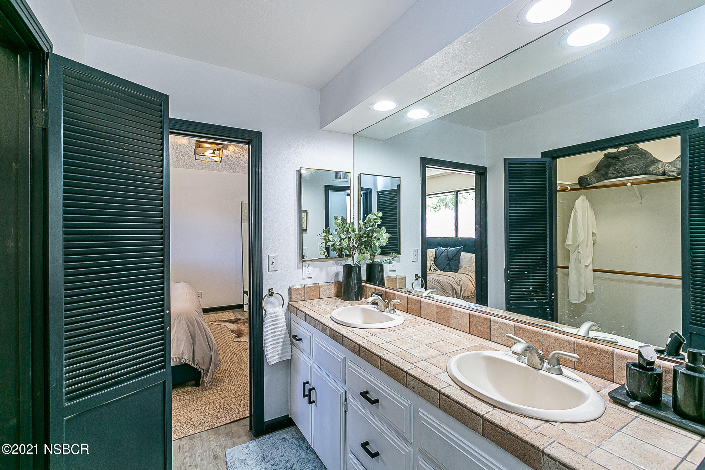 5375 Campbell Road Lompoc, CA 93436 - Photo 18 of 48 a bathroom with a granite countertop sink and a mirror