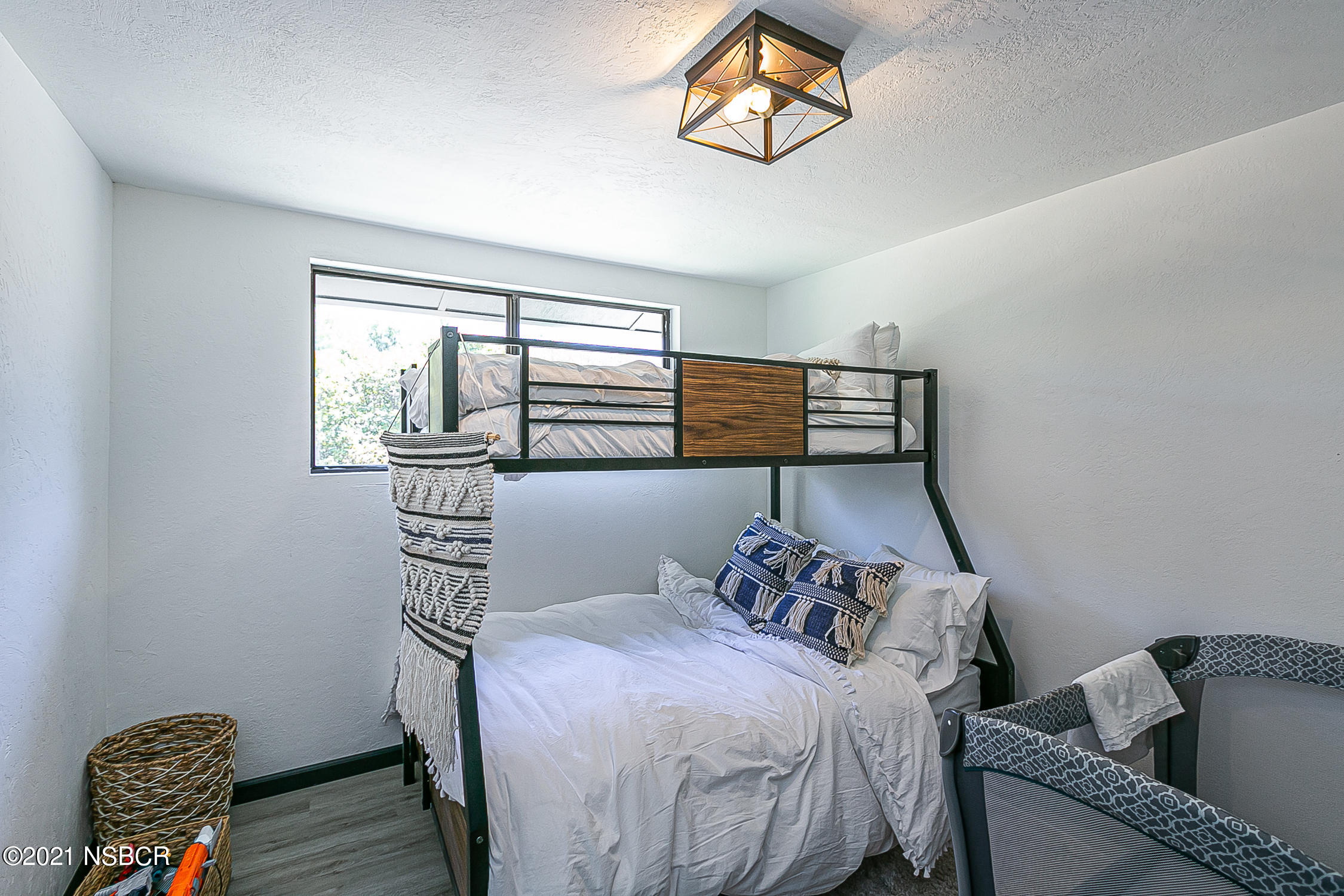5375 Campbell Road Lompoc, CA 93436 - Photo 20 of 48 a bedroom with a bed and wooden floor