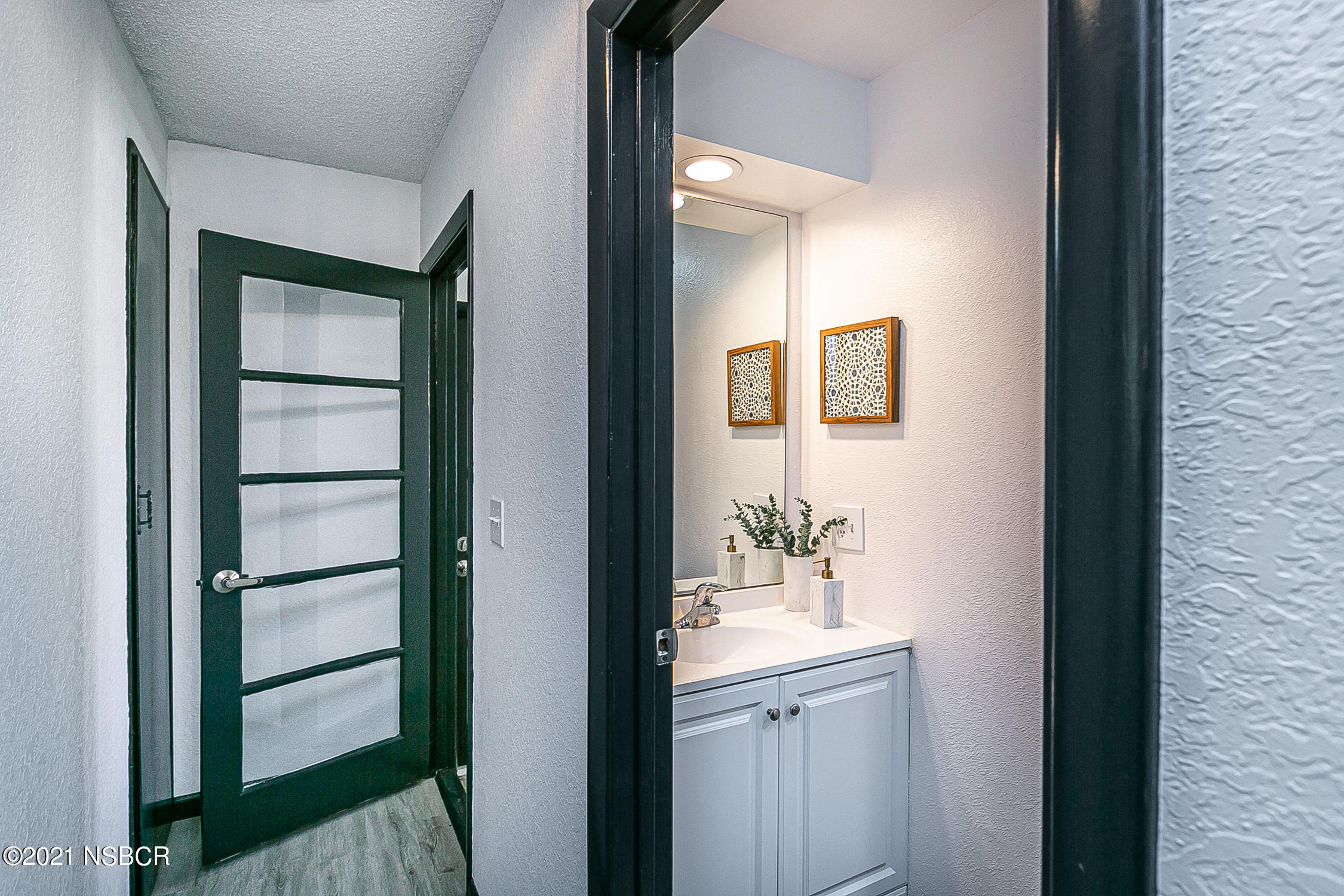 5375 Campbell Road Lompoc, CA 93436 - Photo 22 of 48 a bathroom with a sink a mirror and shower