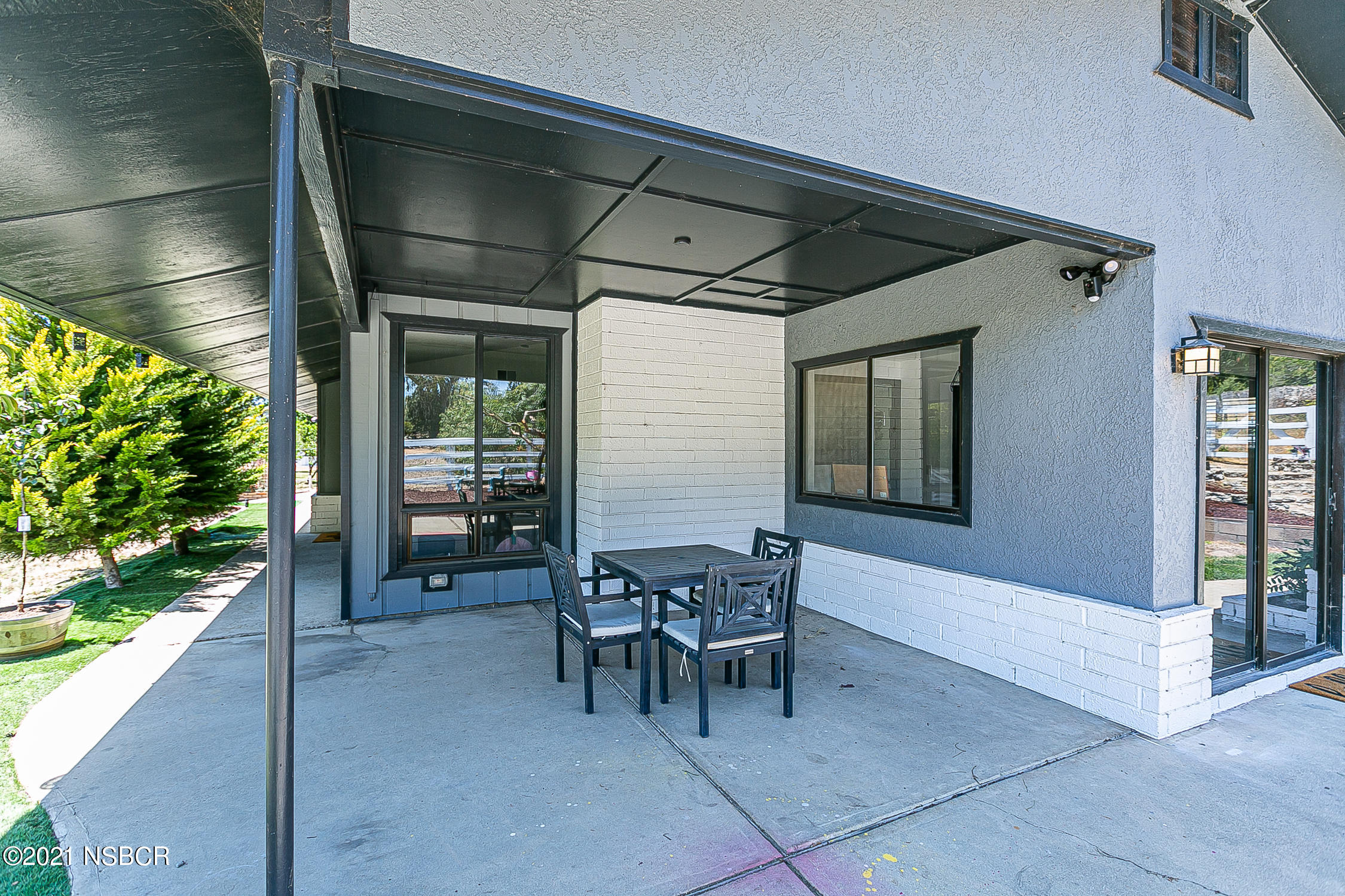 5375 Campbell Road Lompoc, CA 93436 - Photo 25 of 48 a patio with table and chairs and potted plants