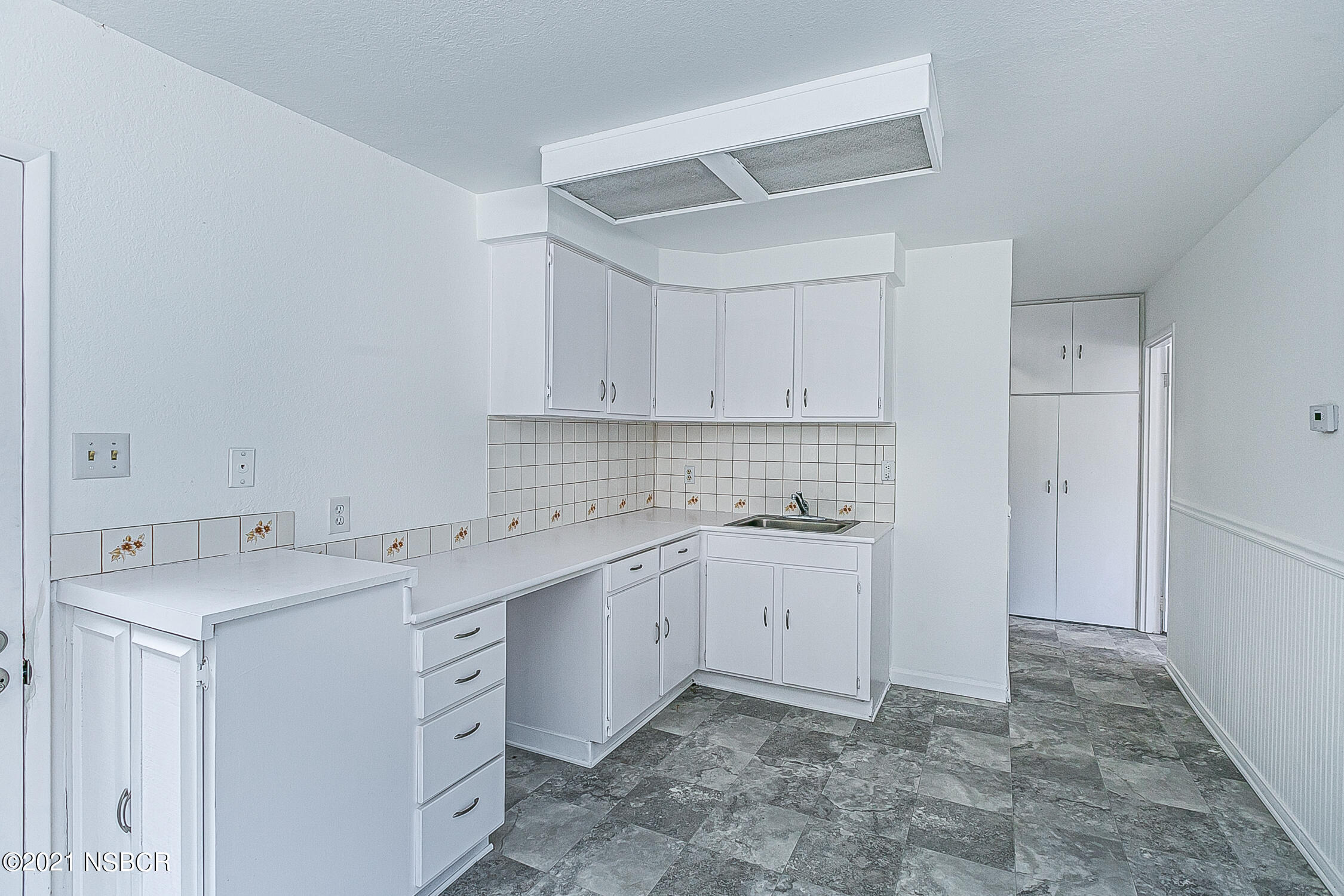 5375 Campbell Road Lompoc, CA 93436 - Photo 38 of 48 a view of a kitchen with cabinets appliances and a sink