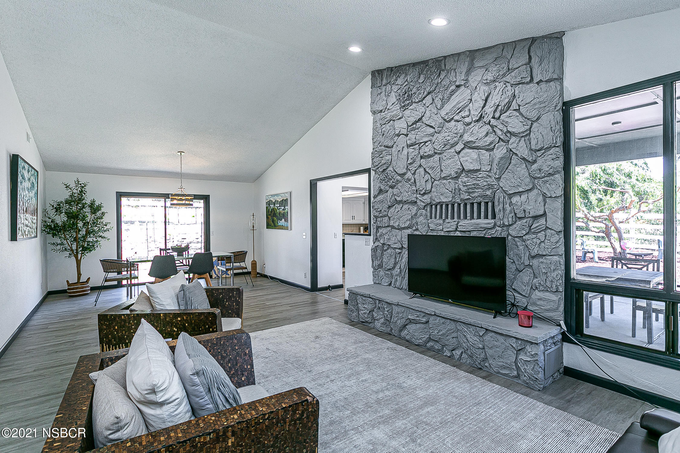 5375 Campbell Road Lompoc, CA 93436 - Photo 6 of 48 a living room with furniture a flat screen tv and a fireplace