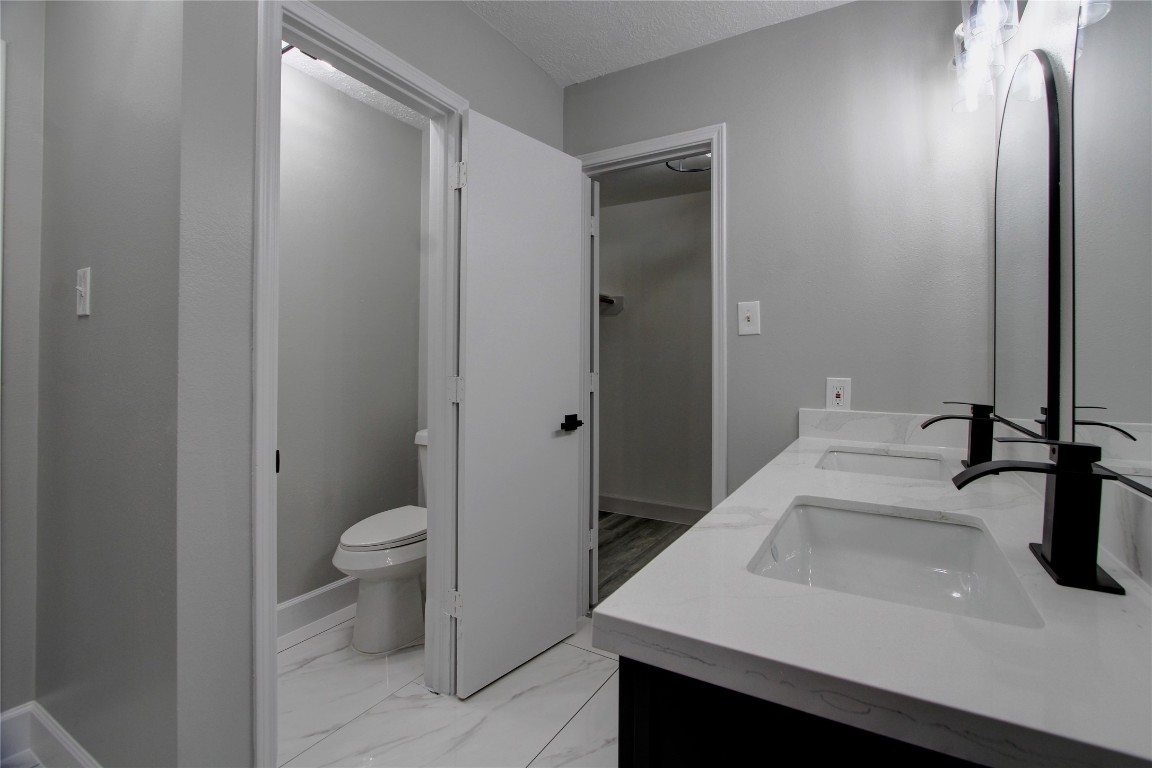 3646 Nutwood Lane Spring, TX 77389 - Photo 11 of 14 a bathroom with a sink and a toilet