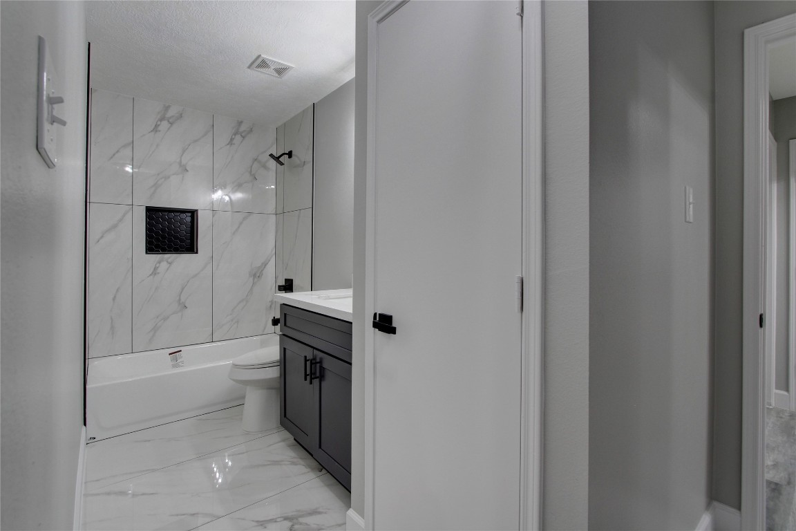 3646 Nutwood Lane Spring, TX 77389 - Photo 12 of 14 a bathroom with a bathtub toilet and shower