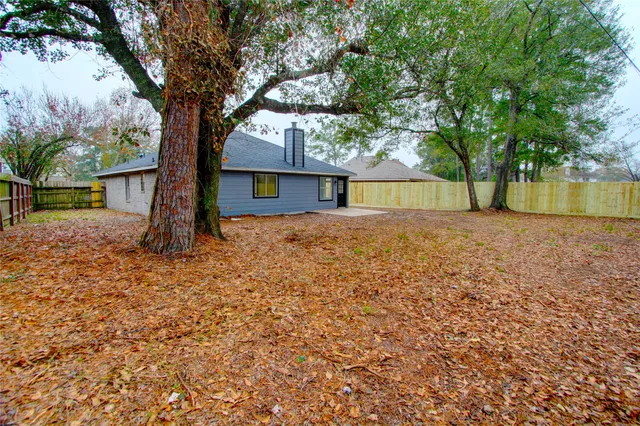 a backyard of a house with lots of green space