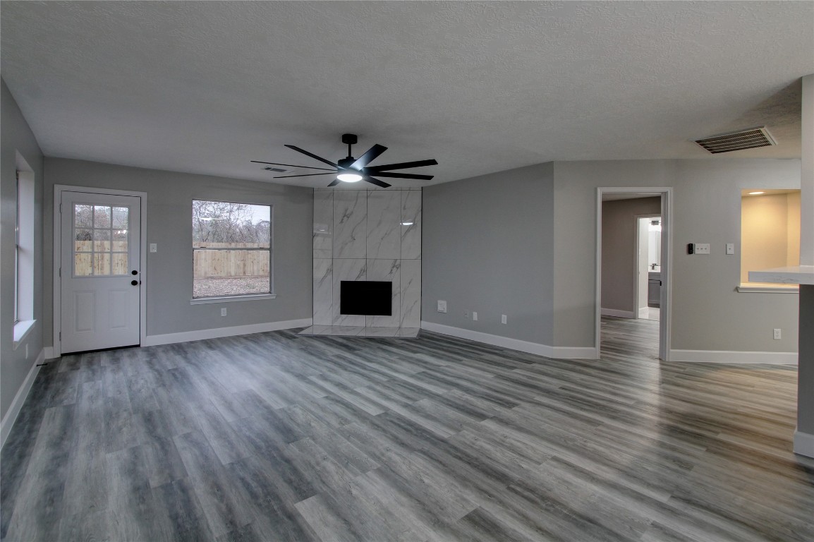 3646 Nutwood Lane Spring, TX 77389 - Photo 3 of 14 a view of an empty room with wooden floor and a fireplace