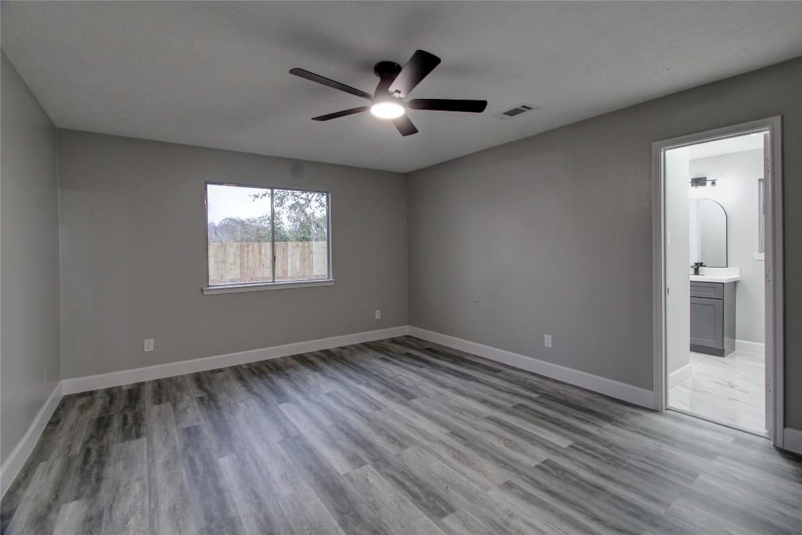3646 Nutwood Lane Spring, TX 77389 - Photo 4 of 14 an empty room with wooden floor and windows