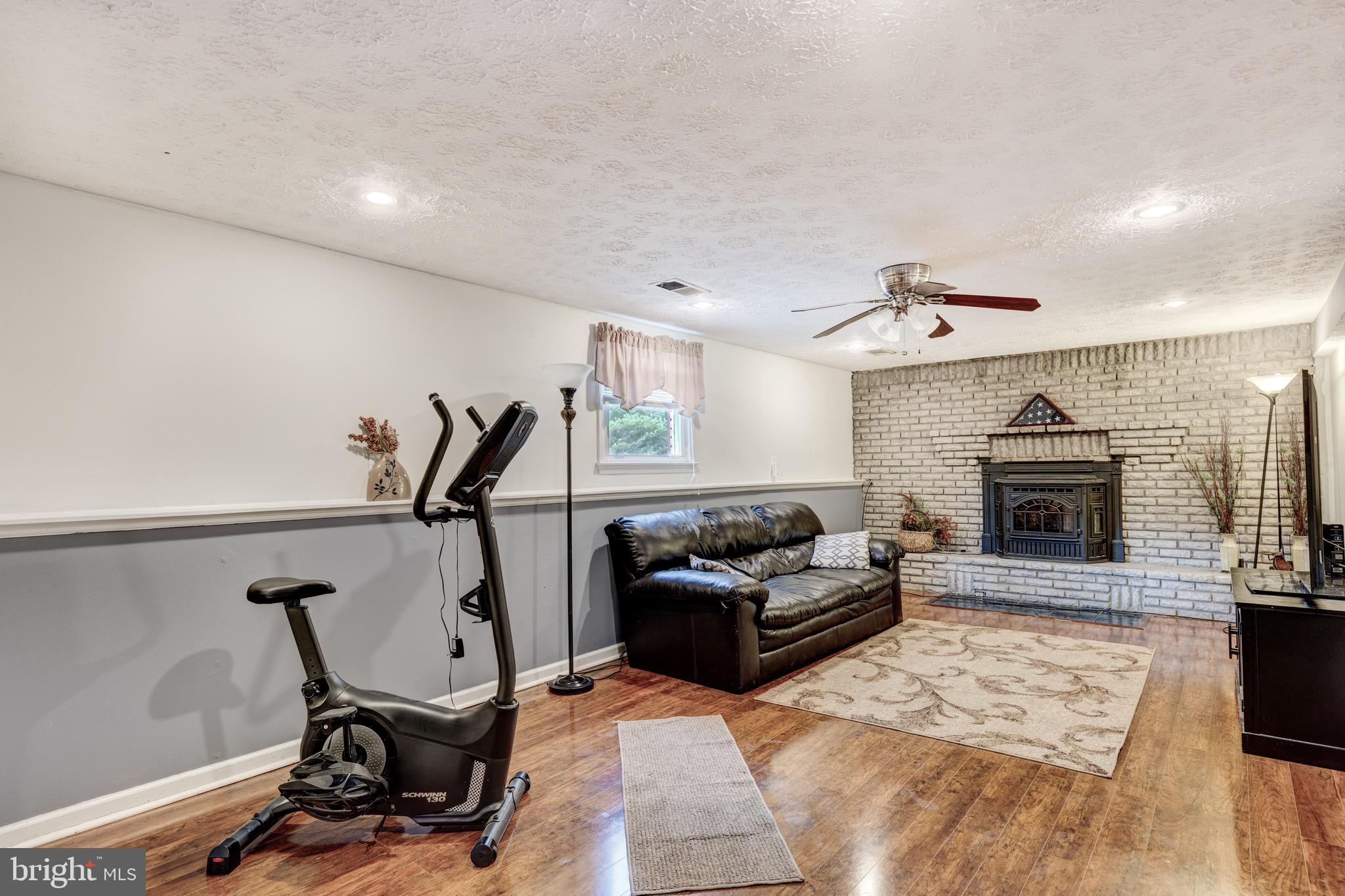 1578 Long Point Road Pasadena, MD 21122 - Photo 28 of 48 Lower Level Family Room with Pellet Stove