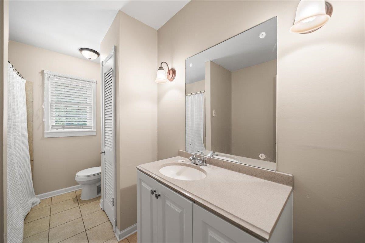 1273 Brookfield Road Memphis, TN 38119 - Photo 29 of 40 Upstairs full bathroom featuring a white vanity with a light-colored countertop, an integrated sink, and a chrome faucet